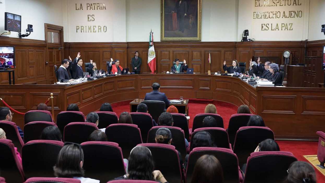 A court session in progress with judges and attendees in a formal setting.