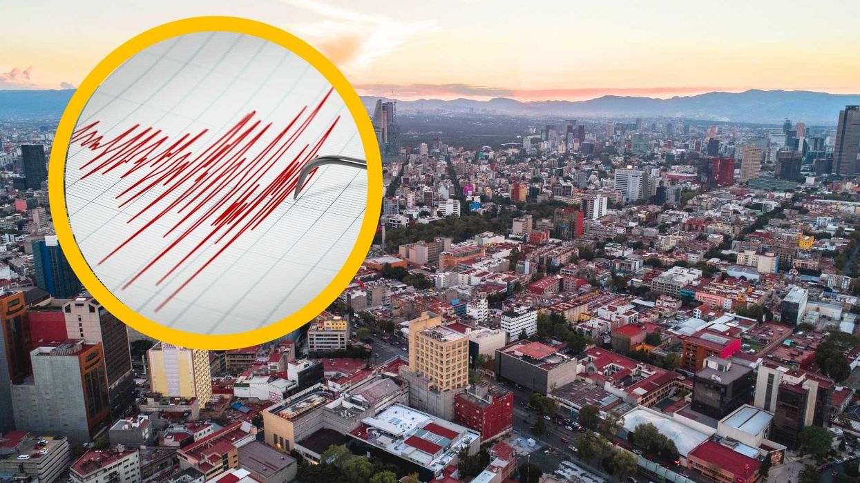 Aerial city view with an earthquake seismograph overlay; sunset in the background.