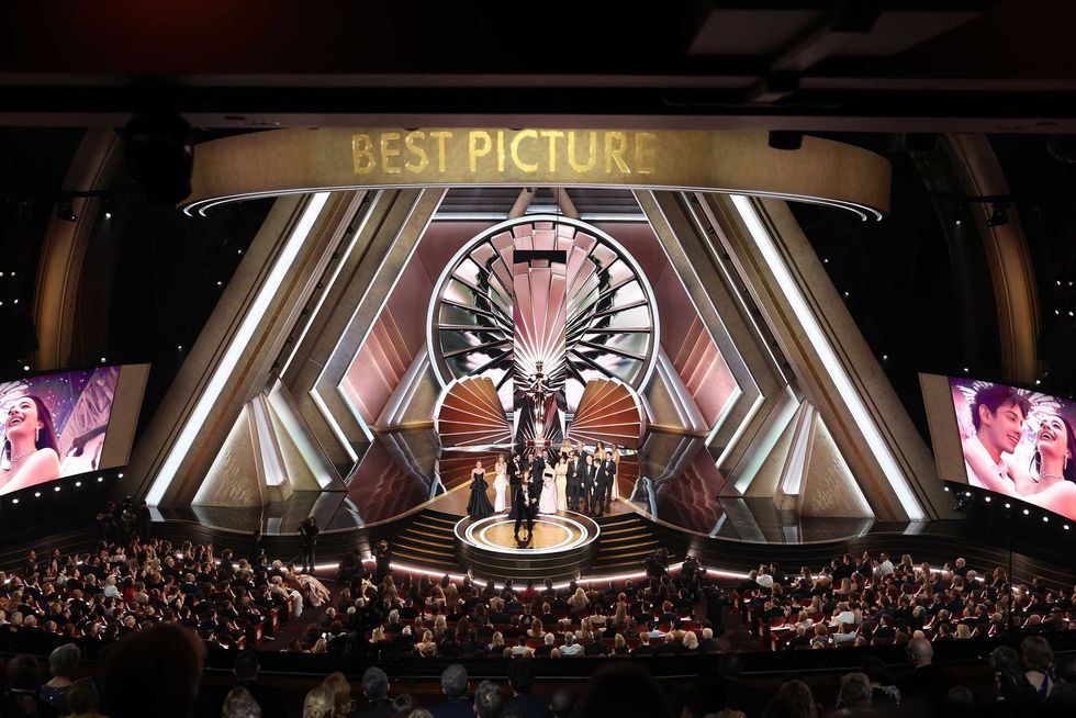 Award ceremony stage with "Best Picture" displayed, large audience seated.