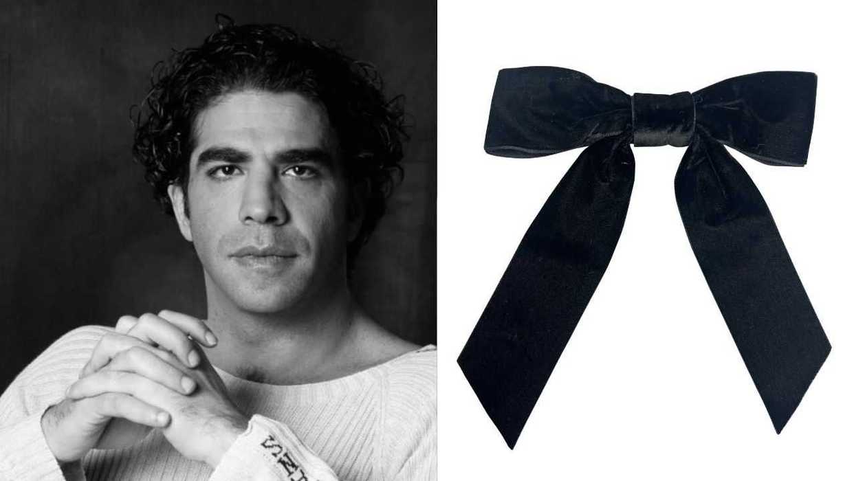 Black-and-white portrait of a person beside a black velvet bow.