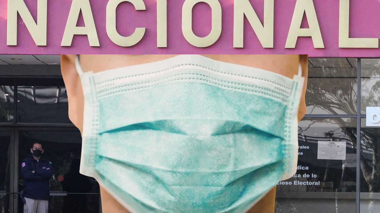 Close-up of a person wearing a green mask in front of a "NACIONAL" sign.