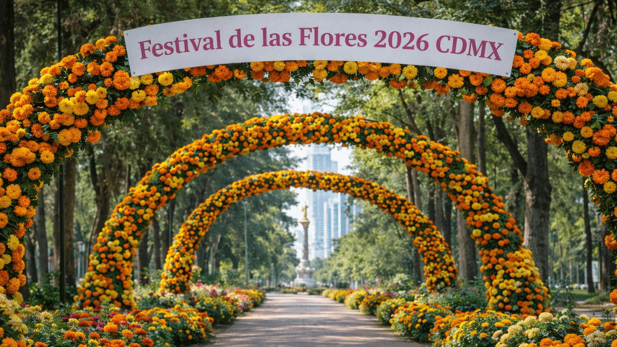 Colorful flower arches at the Festival de las Flores 2026 in a tree-lined park walkway.