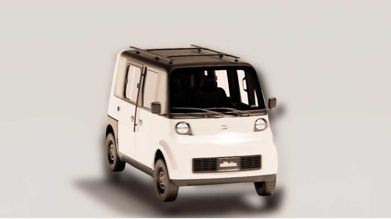 Compact white and black electric vehicle with a boxy design.