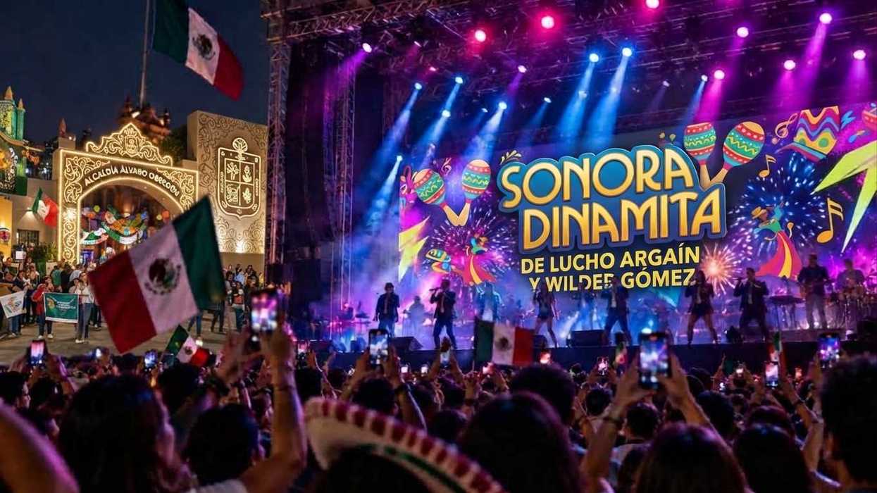 Concert crowd with Mexican flags and vibrant stage lights featuring Sonora Dinamita.