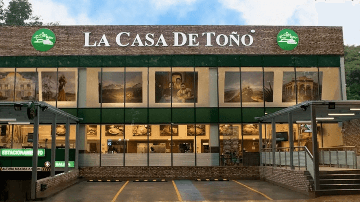 Exterior of La Casa de Toño restaurant with large sign and parking area.