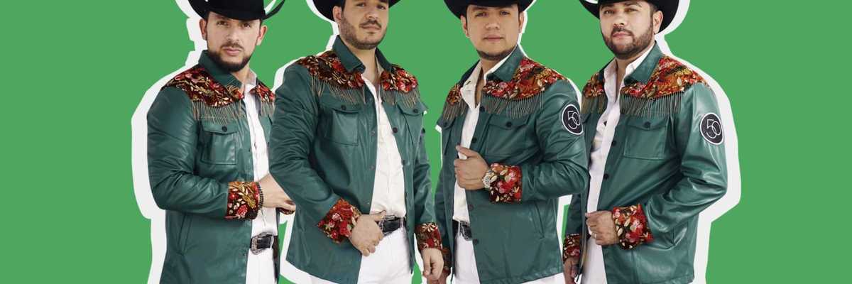 Four men in matching outfits and cowboy hats stand against a green background.