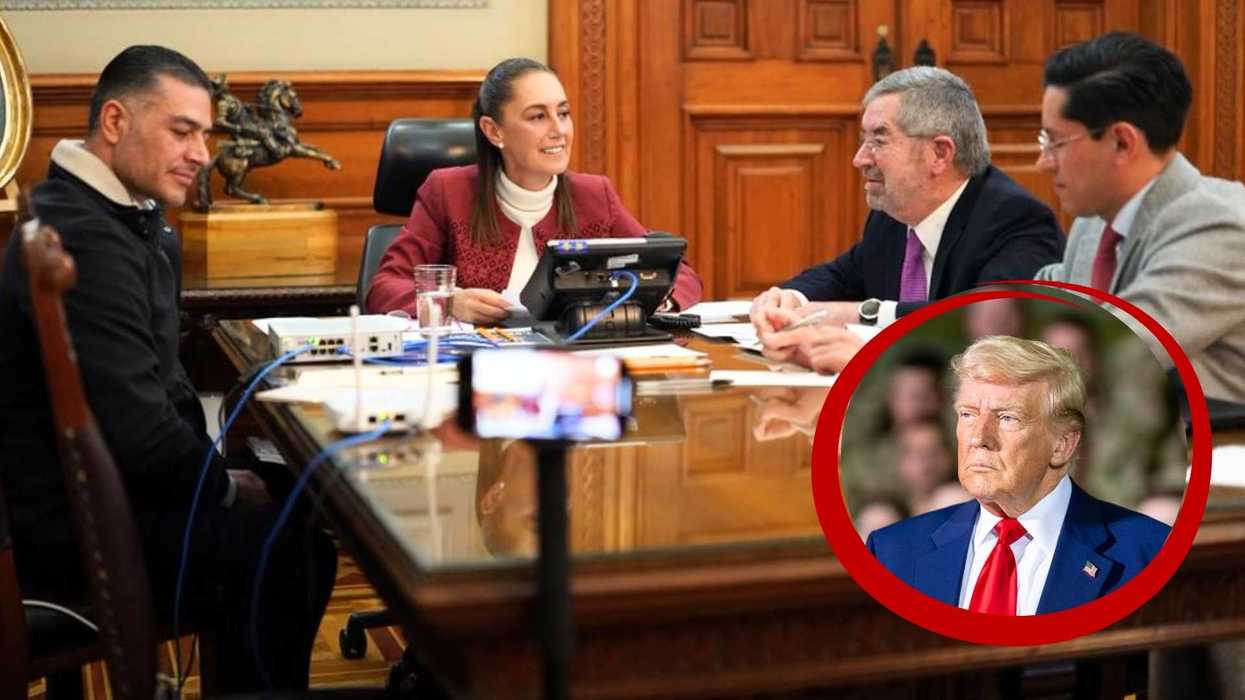 Four people in a meeting at a wooden table, inset of a serious man in a red circle.