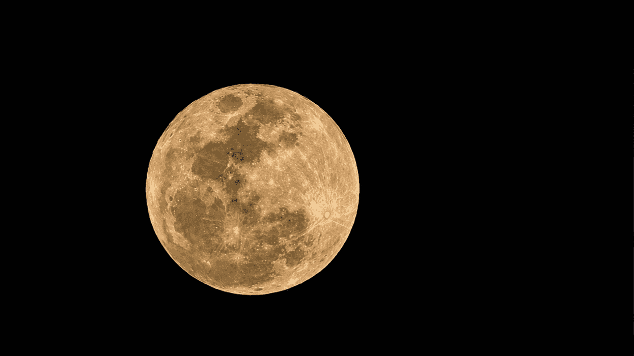 Full moon glowing against a dark sky.