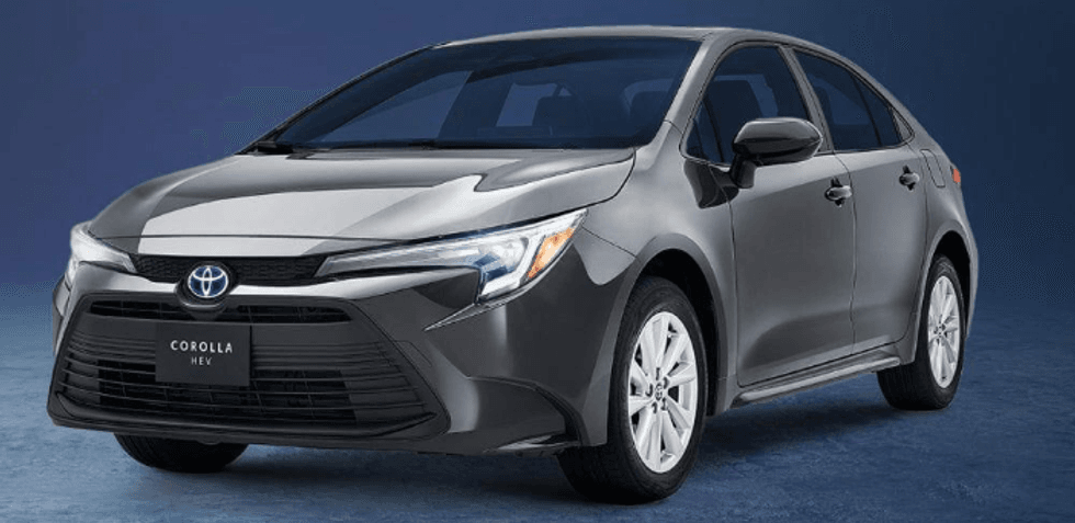 Gray Toyota Corolla HEV car on a blue gradient background.