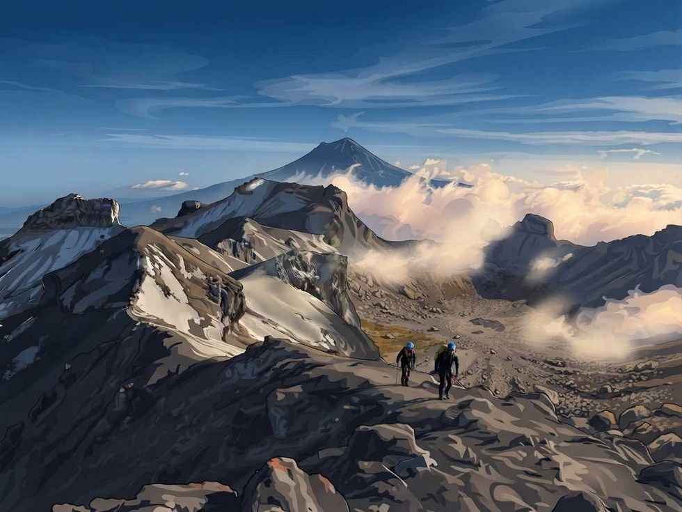 Hikers on a rugged mountain ridge, clouds and distant peaks under a blue sky.