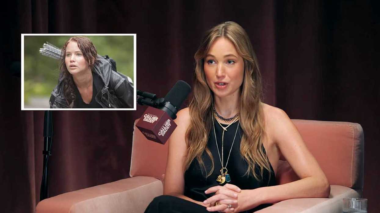 Jennifer Lawrence speaks into a microphone during an interview, with an inset image of her as Katniss.
