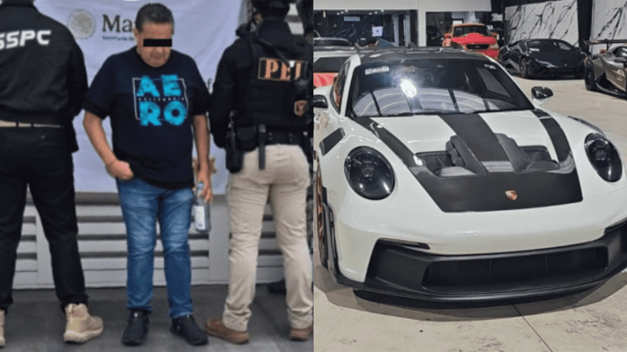 Man detained by officers; luxury sports car in showroom.