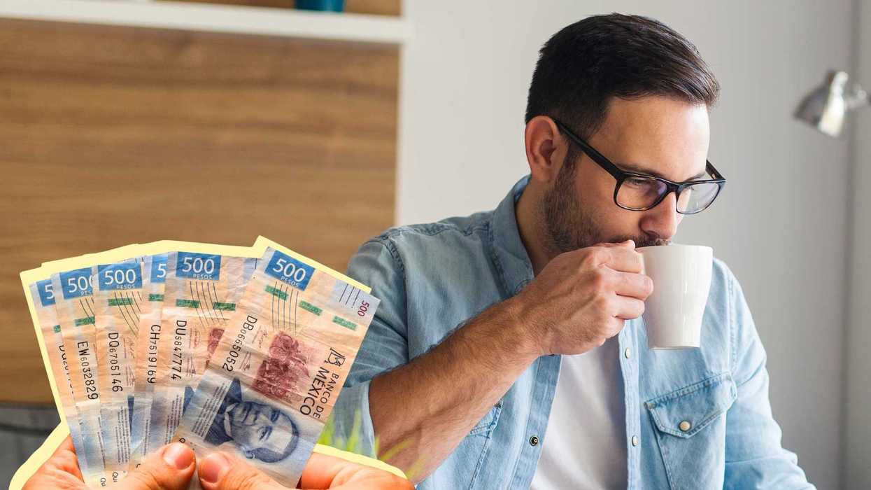 Man drinking coffee, holding Mexican 500 peso bills.