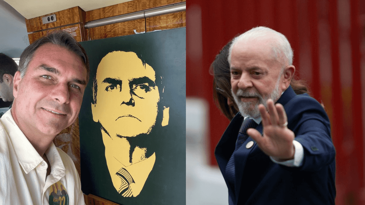 Man posing with painted portrait; another man in suit waving.