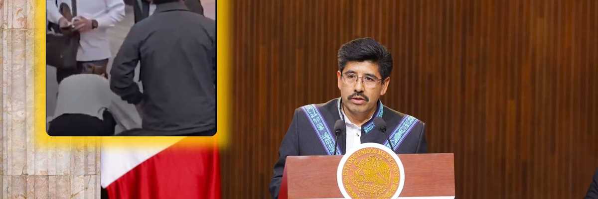 Man speaking at podium, inset shows a few people gathered around an object on the floor.