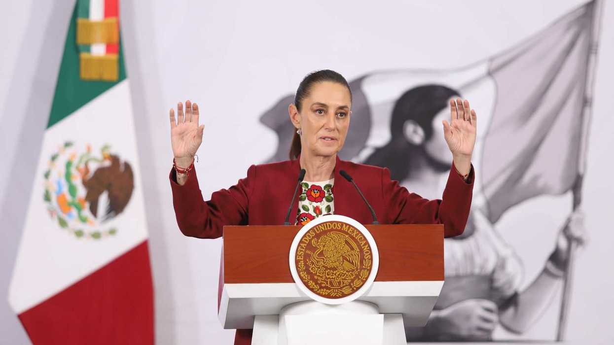Person speaking at a podium with Mexican flag and seal behind them.