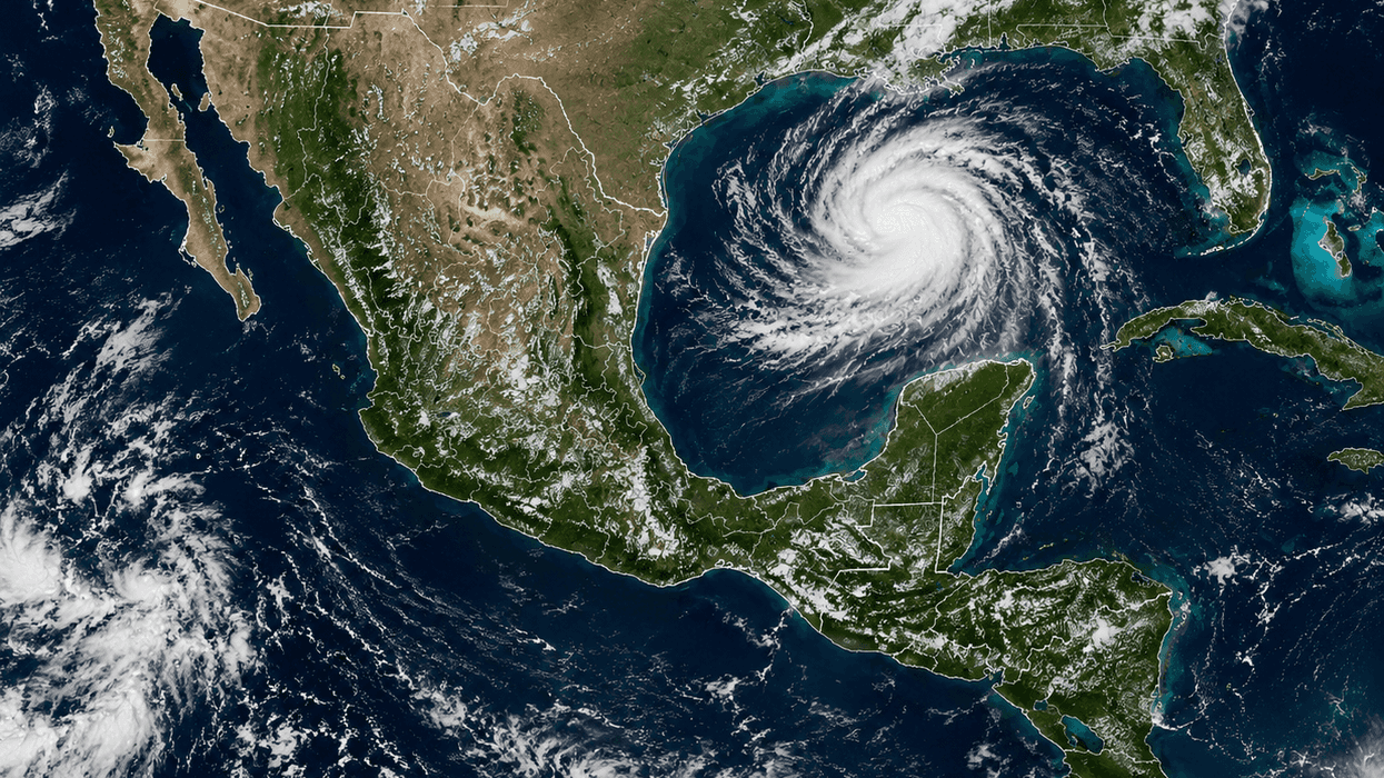 Satellite view of a hurricane swirling in the Gulf of Mexico near the US and Mexican coastlines.