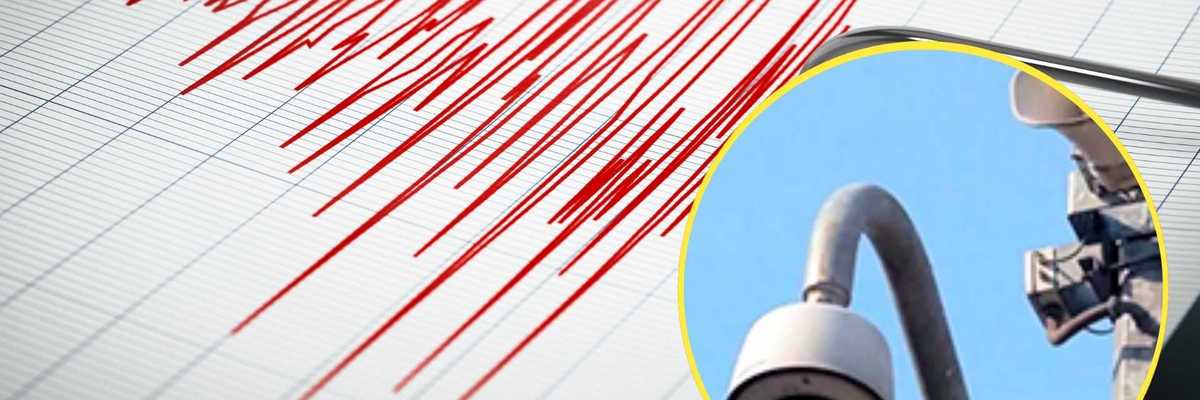 Seismograph with red lines and inset image of a security camera.