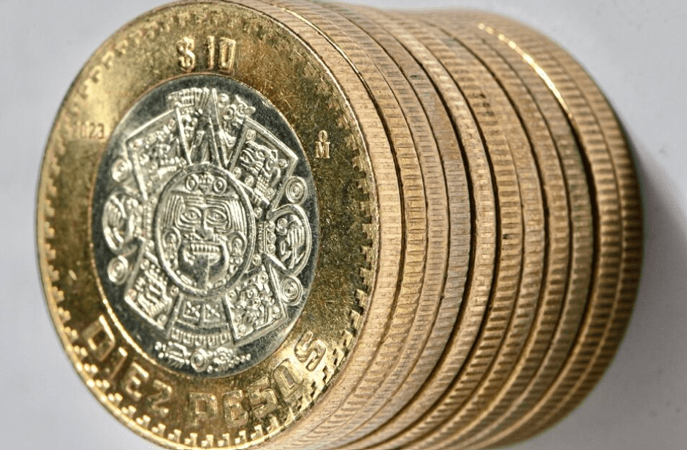 Stack of ten Mexican 10 peso coins, showing the Sun Stone design.