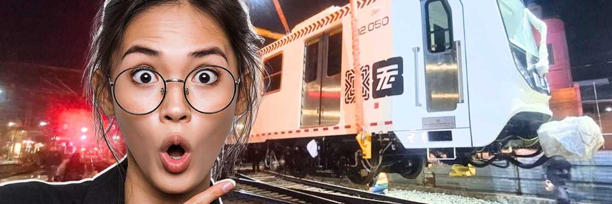 Surprised woman pointing at a train being lifted by cranes at night.