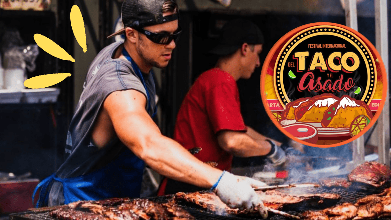 Two people grilling meat at the Taco and Asado festival.
