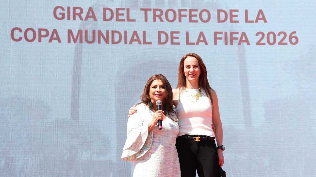 Two women stand on stage at the FIFA World Cup 2026 trophy tour event.