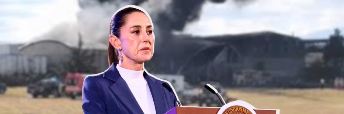 Woman at podium with smoke billowing in background.
