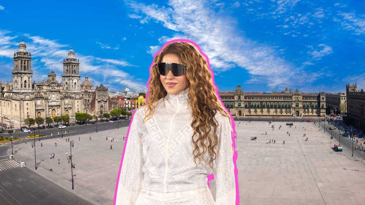 Woman in white outfit with pink outline in front of a historic plaza and blue sky.