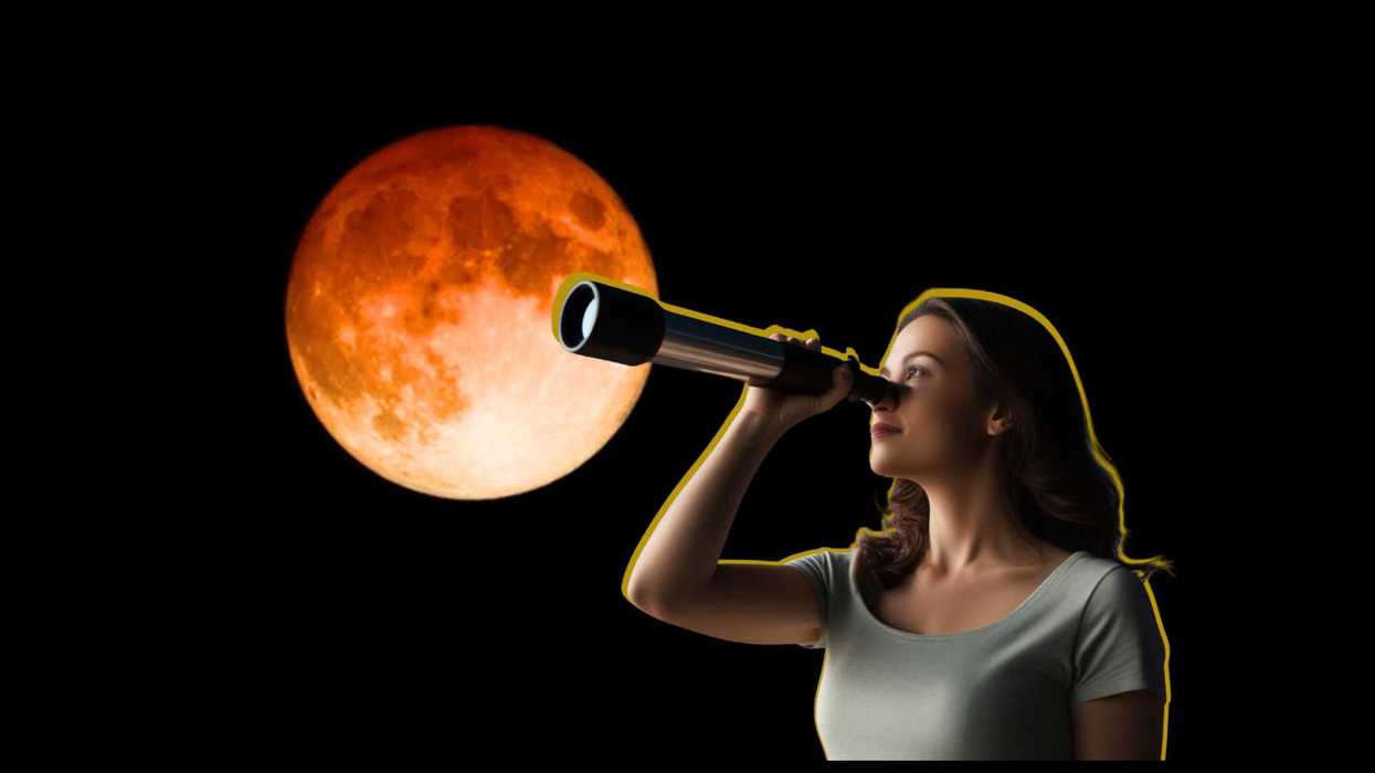 Woman looking through telescope at large orange moon on black background.