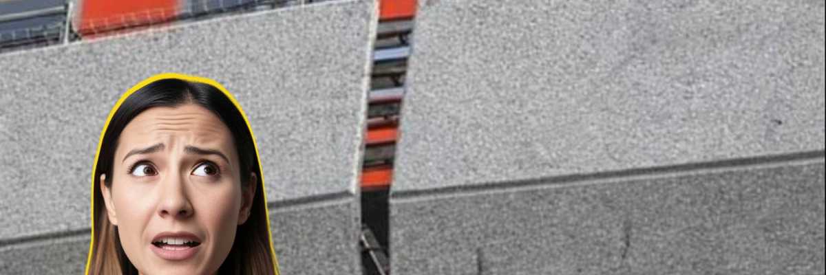 Woman looking worried next to broken elevated train track with train above.