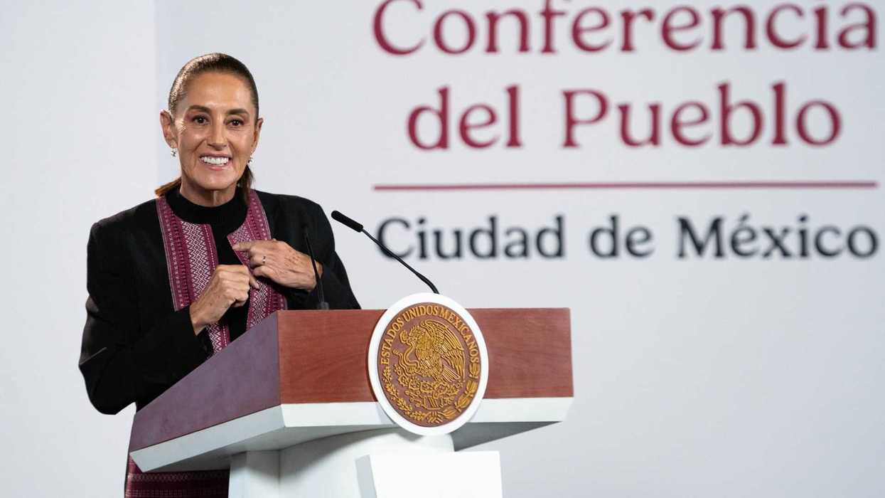 Woman speaking at a podium during a conference in Mexico City.