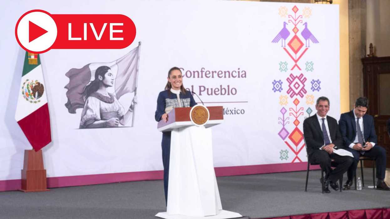 Woman speaking at a podium during a live broadcast in Mexico, with officials seated nearby.
