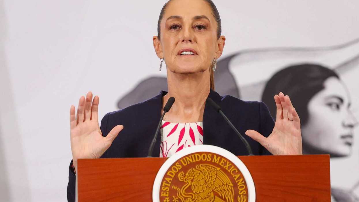 Woman speaking at a podium featuring the Mexican seal.