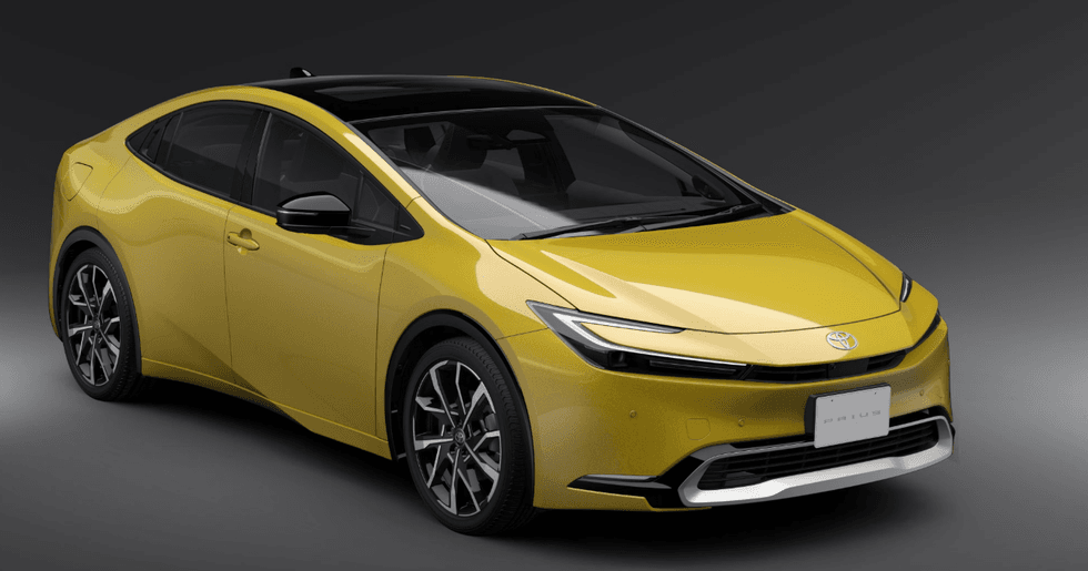 Yellow modern car with sleek design on a gray gradient background.